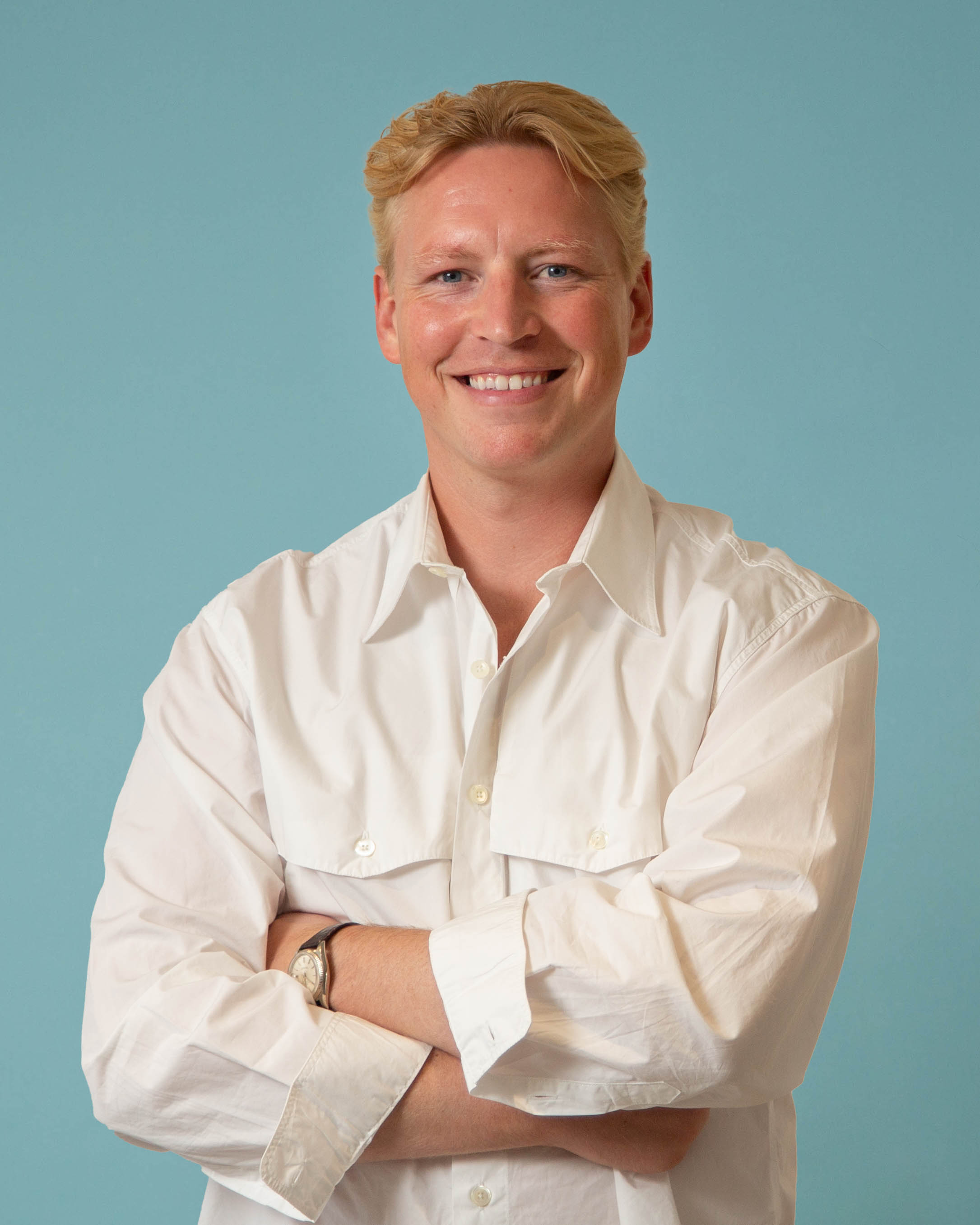 Frederik Thyssen smiling with arms crossed